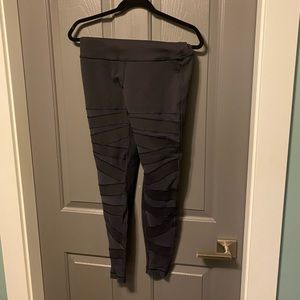 Lululemon leggings with mesh cutouts.